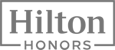 The image shows the Hilton Honors logo, featuring the words "Hilton" and "HONORS" in a stylized design.